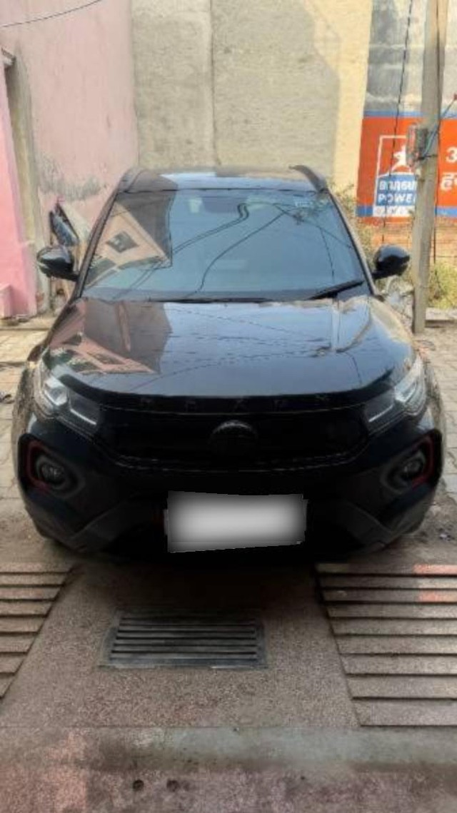 Second-hand 2023 Tata Nexon XZA Plus LUXS Red Dark AMT for sale in New Delhi-0
