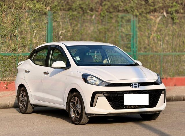 Second-hand 2024 Hyundai Aura SX CNG for sale in Surat
